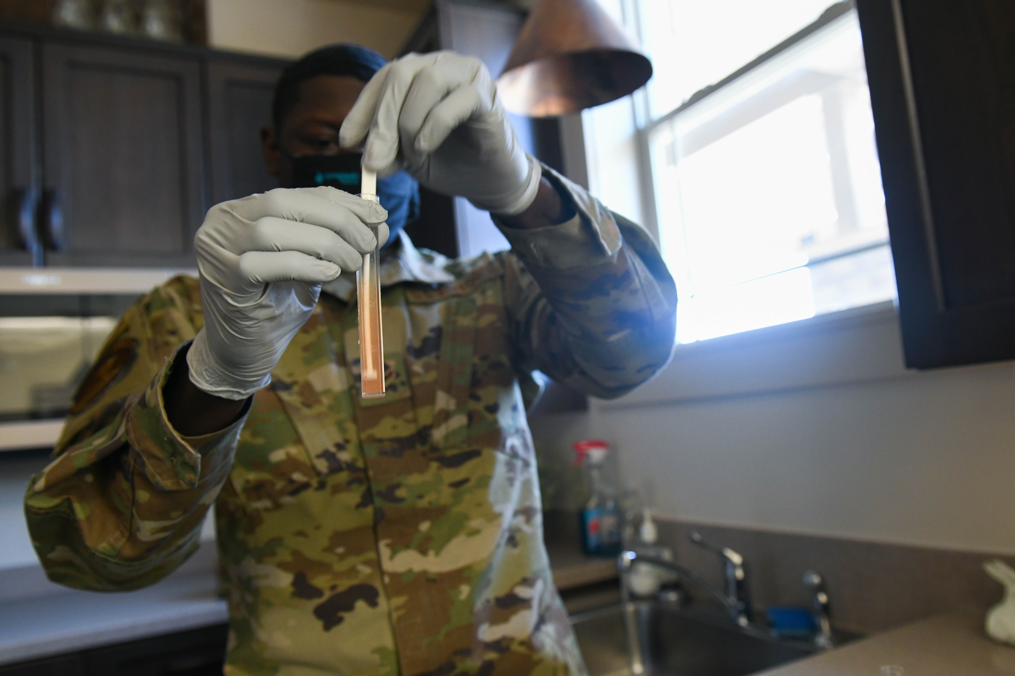 Airman 1st Class Ronald Smith, 22nd Operational Medical Readiness Squadron bioenvironmental engineering technician, performs water-quality tests Mar. 3, 2021, at McConnell Air Force Base Kansas. Bioenvironmental Airmen are responsible for minimizing environmental health hazards in the workplace and ensure safe working conditions. (U.S. Air Force photo by Senior Airman Nilsa Garcia)