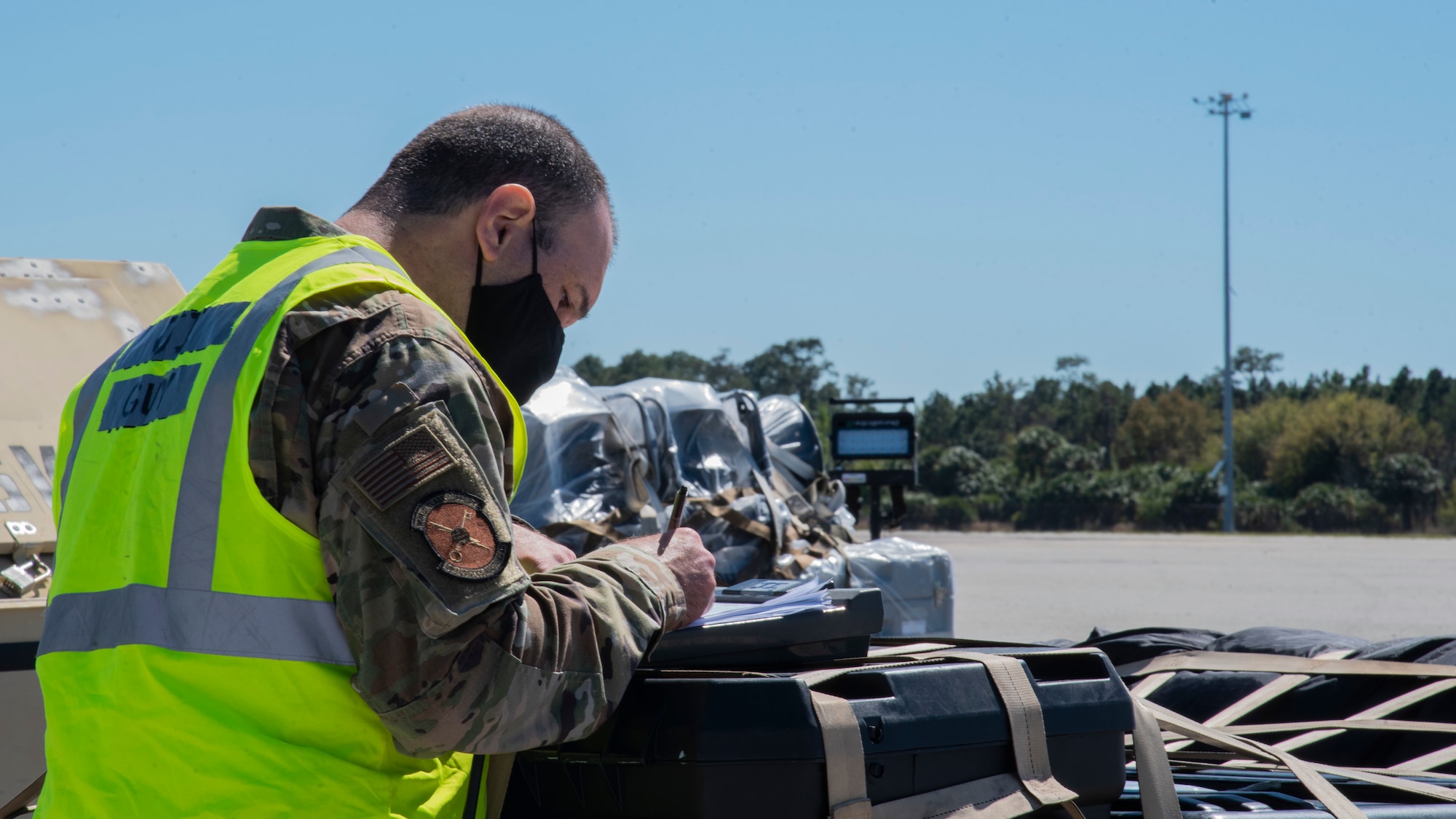 U.S. Air Force Tech. Sgt. Justin Smilo, 6th Logistics Readiness Air Transportation Function noncommissioned officer in charge, checks an inventory list, March 4, 2021, at MacDill Air Force Base, Fla.