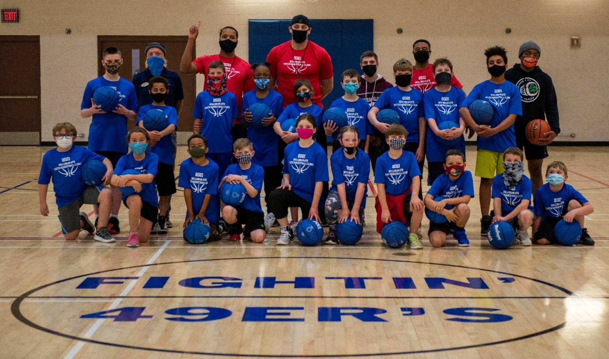 The Holloman Air Force Base Youth and Teen Center basketball clinic athletes and coaches pose for a photo, Feb. 18, 2021, on Holloman AFB, New Mexico. The Youth and Teen Center offers a variety of sports programs for the youth of Holloman to participate in. (Courtesy photo)