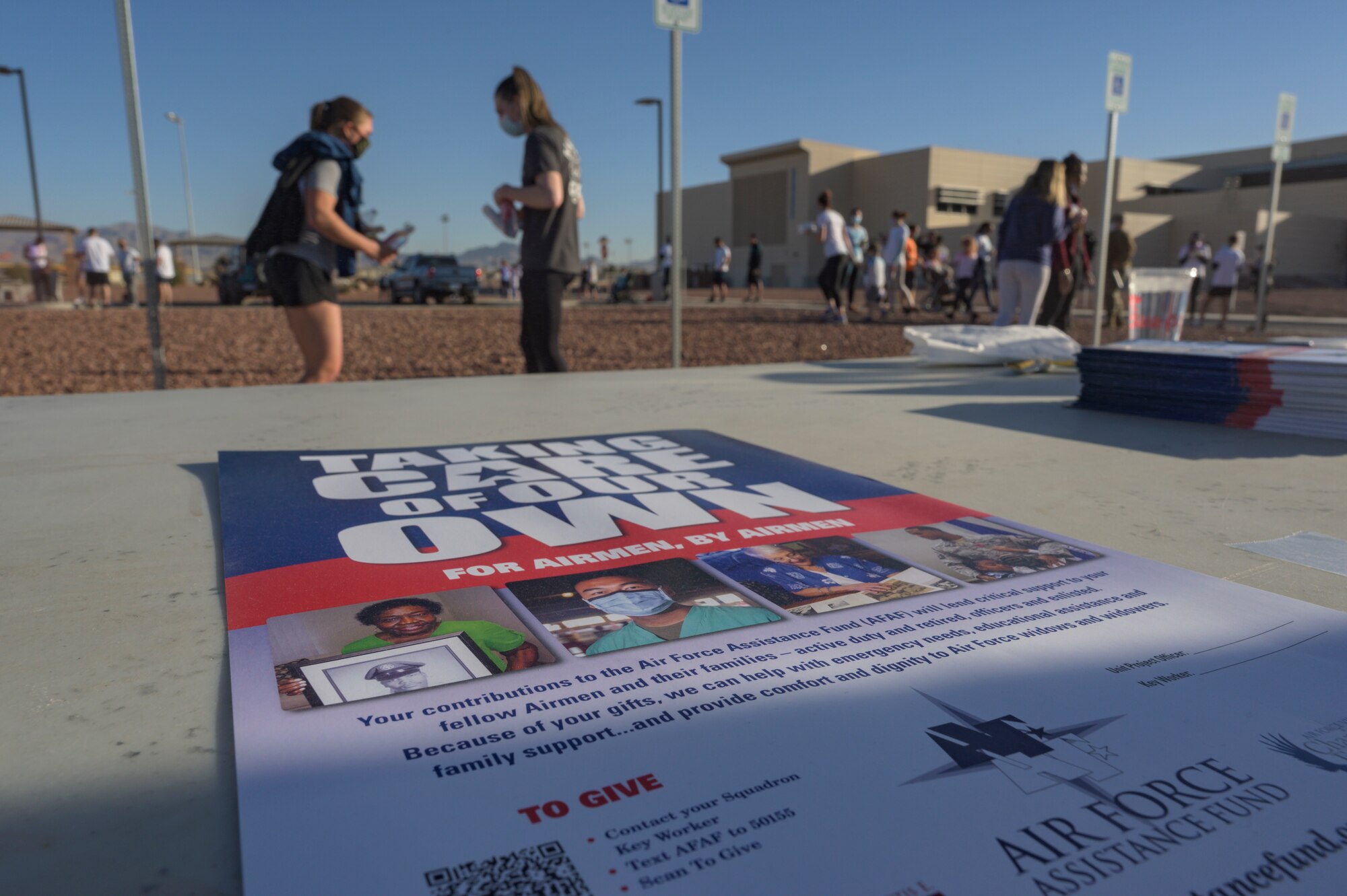 Nellis Air Force Assistance Fund 5k Color Run poster on a  table