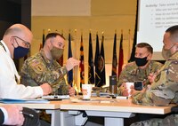 Lt. Col. Dan O'Neill, second from left, deputy commander of the U.S. Army Medical Materiel Agency, talks with USAMMA leaders during an Army Medical Logistics Command workshop on March 4 at Fort Detrick, Maryland. USAMMA is one of three direct reporting units to AMLC. (C.J. Lovelace)