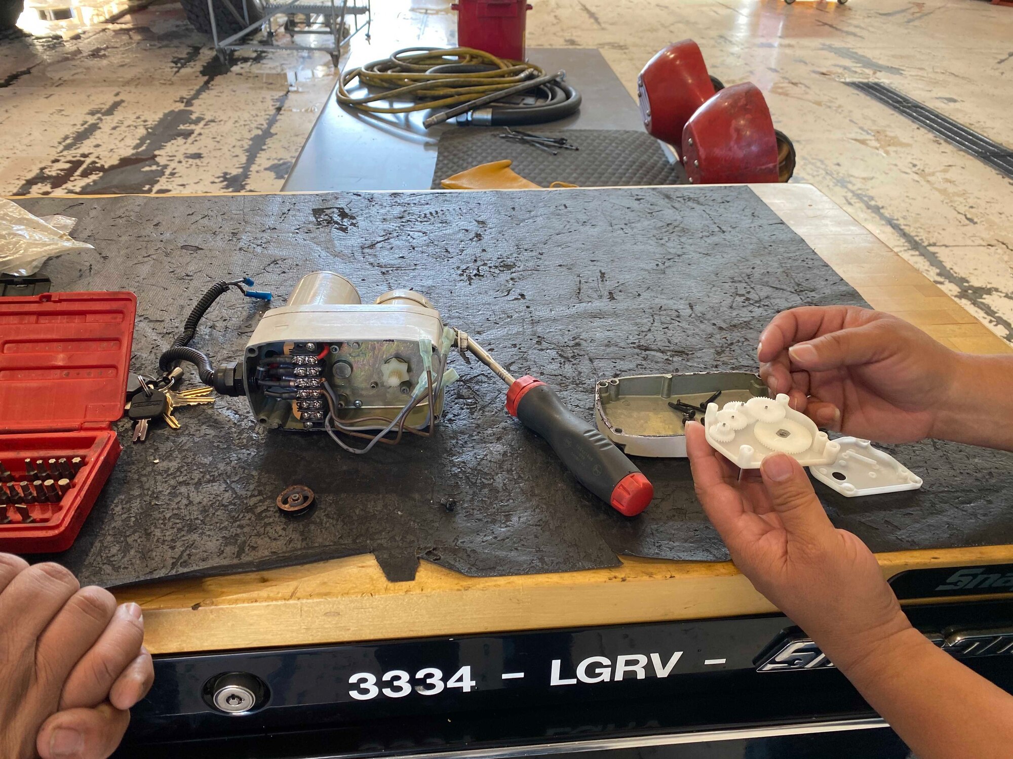 man creates plastic piece to fix firetruck