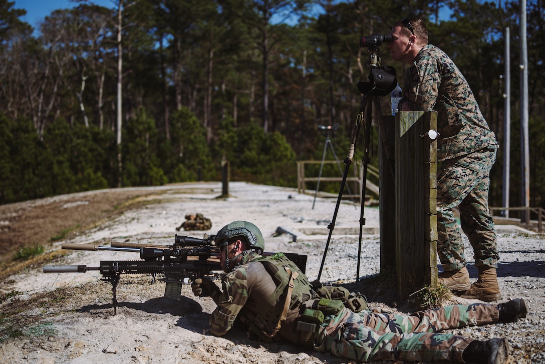 A U.S. Marine with 2d Reconnaissance Battalion (2d Recon Bn.), 2d Marine Division, uses a spotter’s scope to observe impacts from a Dutch Marine with 32nd Raiding Squadron on range G-12, Camp Lejeune, N.C., March 8, 2021. 2d Recon Bn. and Royal Dutch Marines with 32nd Raiding Squadron utilized the range for sniper training during Exercise Caribbean Urban Warrior, a bilateral training evolution which increases interoperability between the two countries in various environments. (U.S. Marine Corps photo by Cpl. Corey A. Mathews)