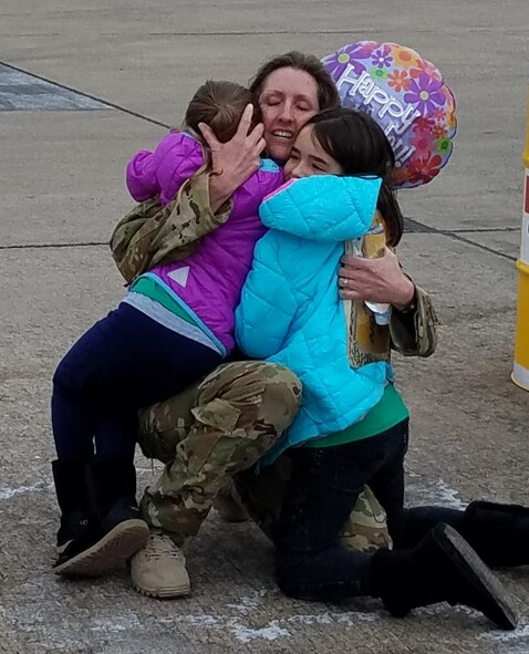 Col. Angela Ochoa when she returned from a deployment in 2018 to her two daughters, Elsa and Seanna. She shares a letter to them during Women's History Month about how to courageously lead based on some of the experiences she has had while in the Air Force. (Courtesy photo)