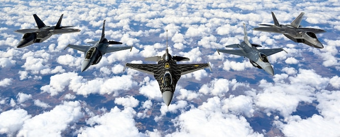 Pilots with the F-16 Viper and F-22 Raptor Demonstration Teams fly behind a KC-135 Stratotanker from the 465th Air Refueling Squadron assigned to Tinker Air Force Base, Oklahoma March 8, 2021. The F-16 team from Shaw Air Force Base, South Carolina, and the F-22 team from Joint Base Langley–Eustis, Virginia, are assigned to Air Combat Command and received fuel from the Okies during their flight back to their home stations after performing at an air show. (U.S. Air Force photo by Senior Airman Mary Begy)