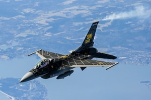 An F-16 Viper Demonstration Team pilot flies behind a KC-135 Stratotanker from the 465th Air Refueling Squadron, Tinker Air Force Base, Oklahoma, March 8, 2021. The F-16 team from Shaw Air Force Base, South Carolina, is assigned to Air Combat Command and received fuel from the Okies during their flight back to  their home station after performing at an air show. (U.S. Air Force photo by Senior Airman Mary Begy)