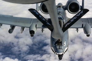 An A-10 Thunderbolt II from the 75th Fighter Squadron, Moody Air Force Base, Georgia, refuels from a KC-135 Stratotanker from 465th Air Refueling Squadron, Tinker Air Force Base, Oklahoma, on their way to Red Flag March 5, 2021. Refueling with the Okies allowed the A-10s to make it to the exercise without having to land. (U.S. Air Force Base photo by Senior Airman Mary Begy)