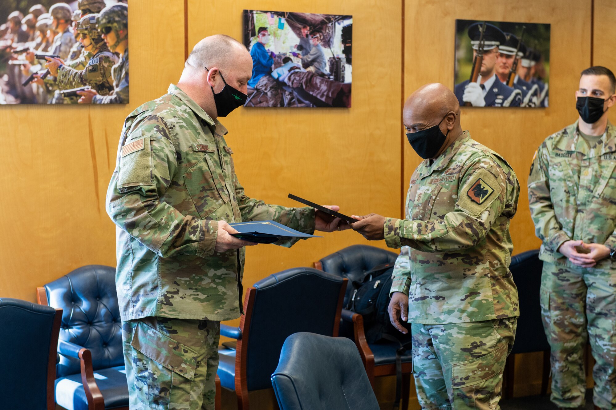 Senior enlisted advisor of the National Guard Bureau, Chief Master Sgt. Tony L. Whitehead, speaks to Chief Master Sgt. Jeffrey Stebbins, command chief of the 158th Fighter Wing, Vermont National Guard.