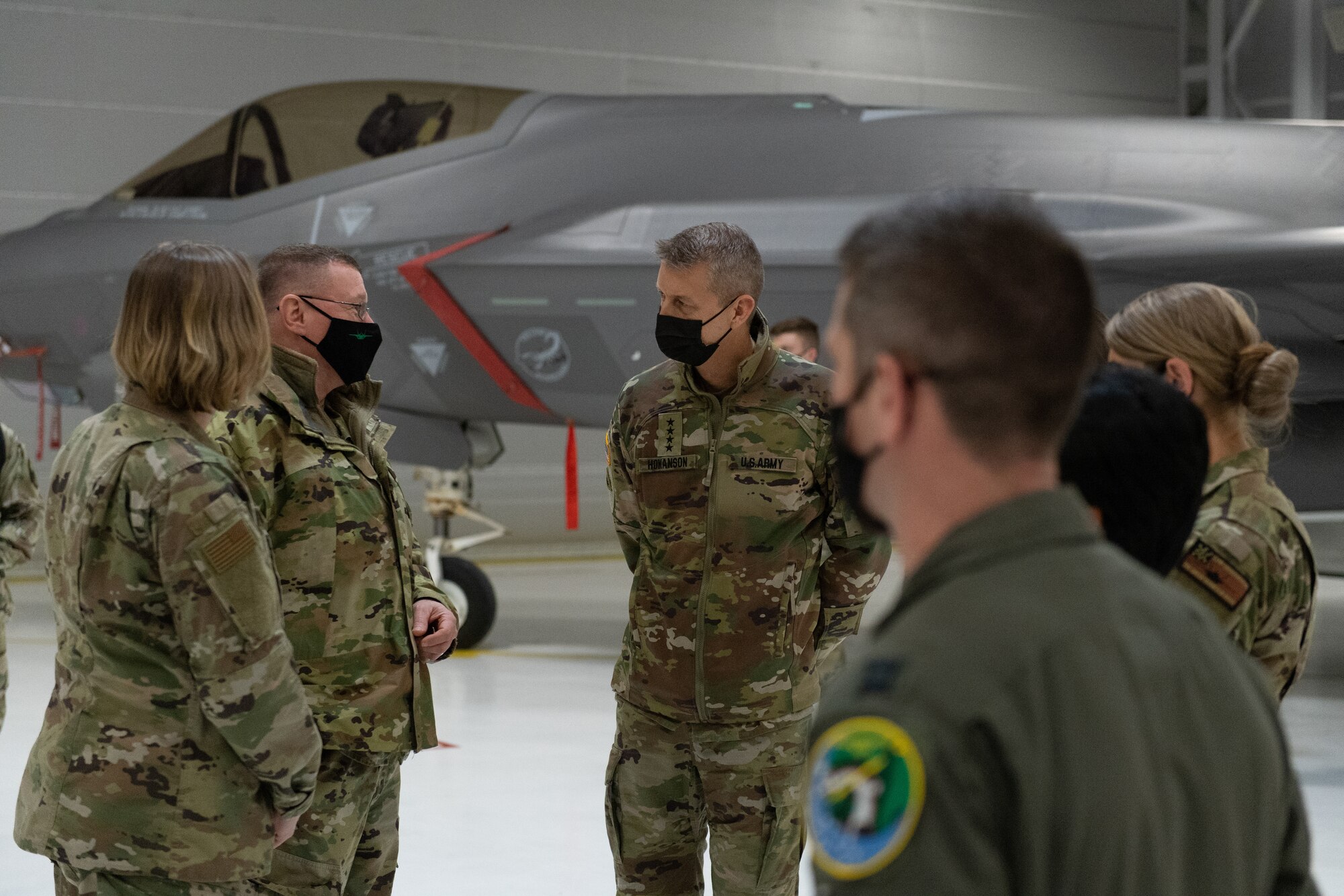 U.S. Army General Daniel R. Hokanson, chief, National Guard Bureau, speaks with Vermont’s adjutant general, U.S. Army Maj. Gen. Gregory Knight, and Airmen assigned to the 158th Fighter Wing.