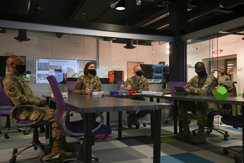 From left, Chief Master Sgt. Nathaniel Perry, U.S. Air Force first sergeant special duty manager, Chief Master Sgt. of the Air Force JoAnne Bass, Col. Tyler Schaff, 316th Wing and Joint Base Andrews commander, and Chief Master Sgt. Ezekiel Ross, 316th Wing command chief, attend briefings by various members of JBA senior leadership at the SparkX Cell Innovation and Idea Center during the CMSAF’s tour, Joint Base Andrews, Md., March 4, 2021.