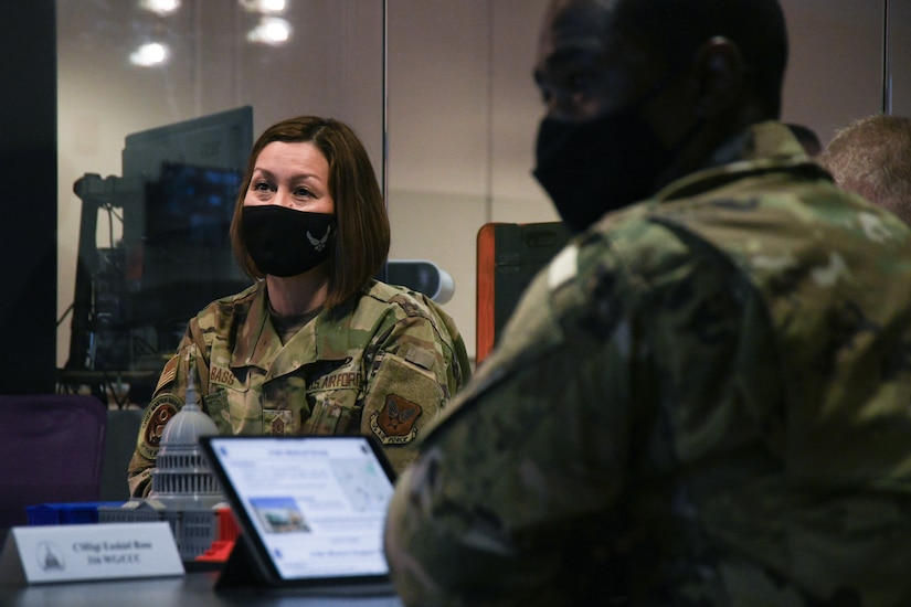 Chief Master Sgt. of the Air Force JoAnne Bass attends a briefing by 316th Medical Group senior leadership at the SparkX Cell Innovation and Idea Center during her tour, Joint Base Andrews, Md., March 4, 2021.