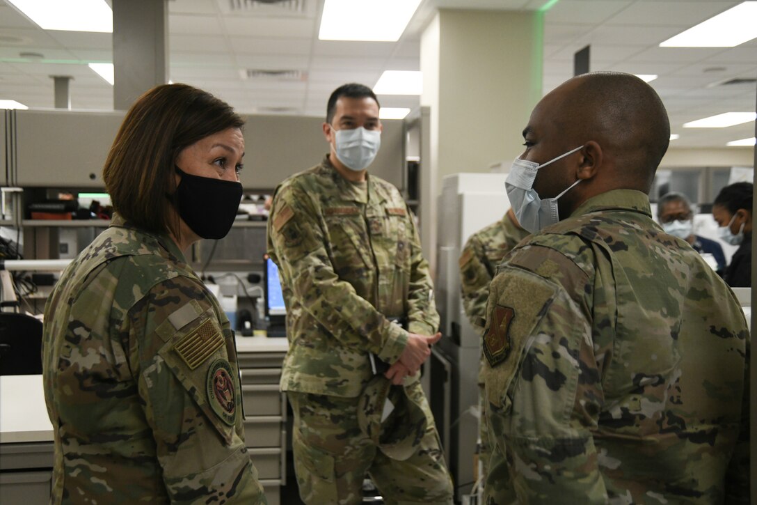 Chief Master Sgt. of the Air Force JoAnne Bass meets with 316th Medical Group personnel in the laboratory at Malcolm Grow Medical Clinics and Surgery Center during her tour, Joint Base Andrews, Md., March 4, 2021.