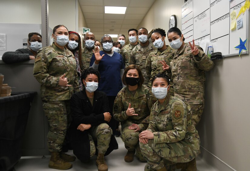 Chief Master Sgt. of the Air Force JoAnne Bass and 316th Medical Group personnel pause during her base tour to pose for a photo in the laboratory at Malcolm Grow Medical Clinics and Surgery Center, Joint Base Andrews, Md., March 4, 2021.