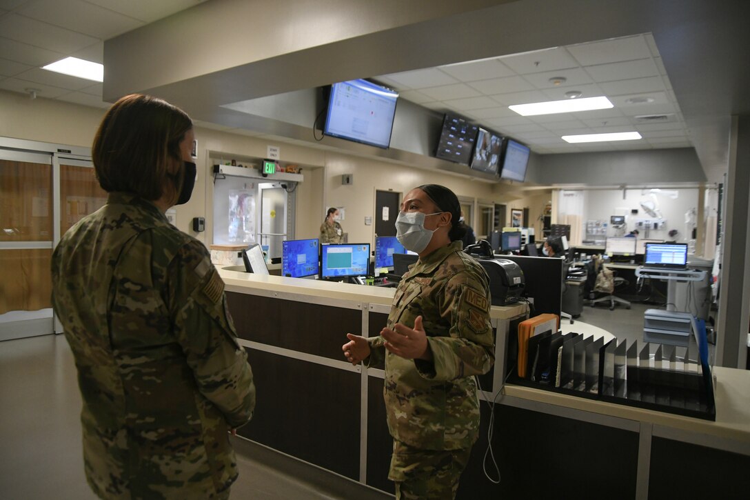 Senior Airman Maritza Hurtado, 316th Medical Group member, briefs Chief Master Sgt. of the Air Force JoAnne Bass about the Emergent Care Clinic mission and duties at Malcolm Grow Medical Clinics and Surgery Center, Joint Base Andrews, Md., March 4, 2021.