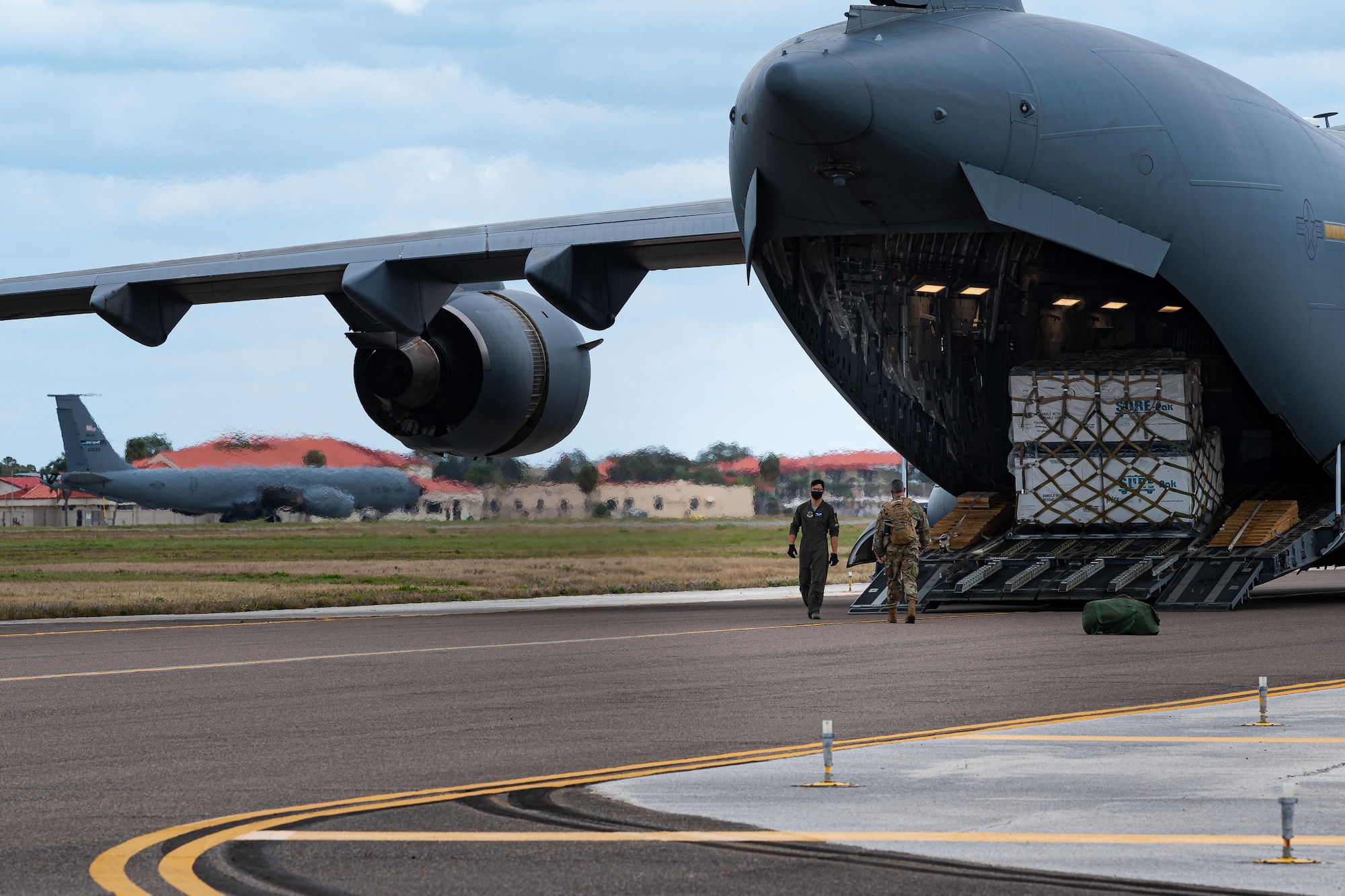 A photo of Airmen preparing to unload an aircraft