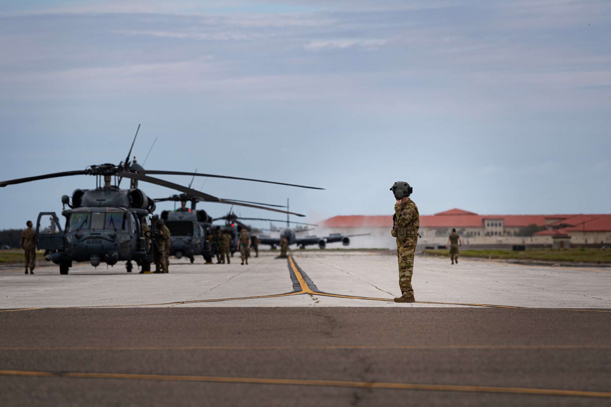 A photo of Airmen departing aircraft onto the flightline