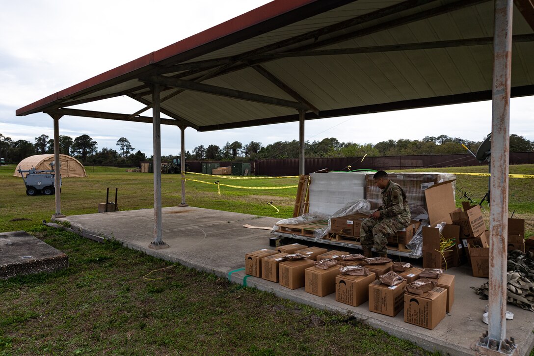 A photo of an Airman taking accountability of Meals, Ready to Eat