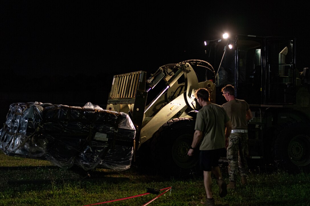 A photo of Airmen unloading supplies