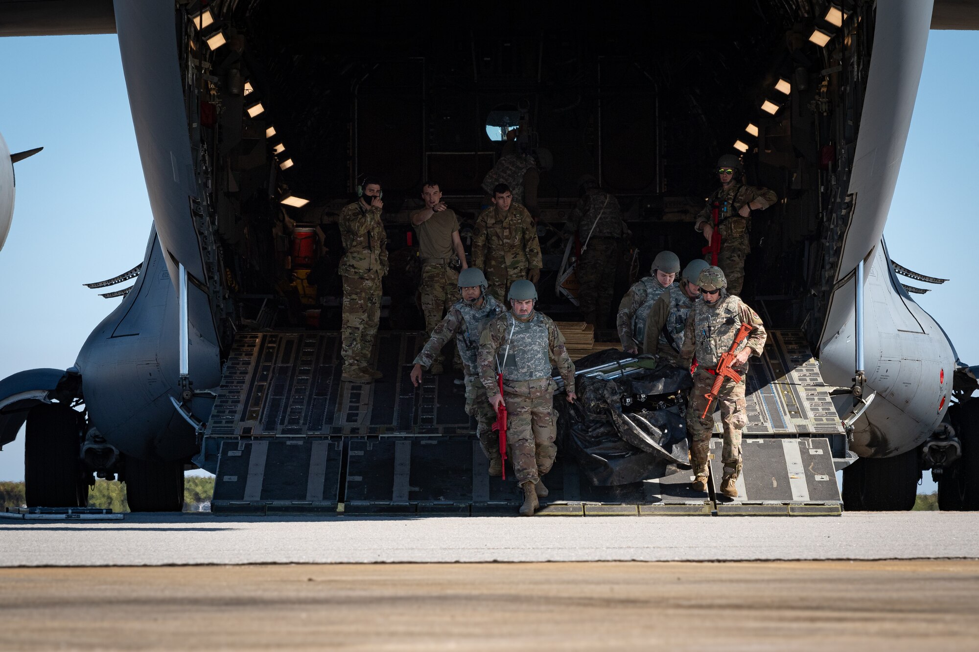 A photo of Airmen offloading cargo from an aircraft