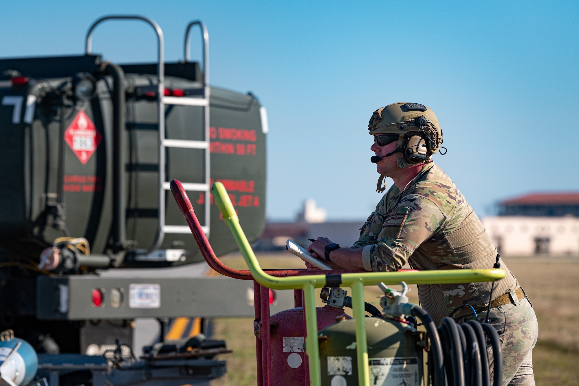 A photo of an Airman observing an exercise