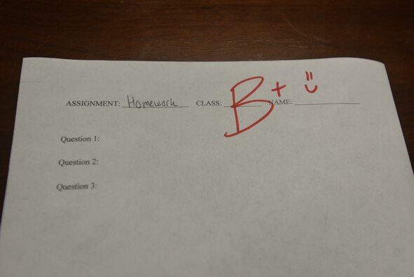 A paper displays a B+ grade for an assignment at Goodfellow Air Force Base, Texas, March 10, 2021. Students can present a valid military ID and proof of a B average or higher to customer service at the Goodfellow Main Store to receive a $5 Exchange gift card. (U.S. Air Force photo by Senior Airman Ashley Thrash)