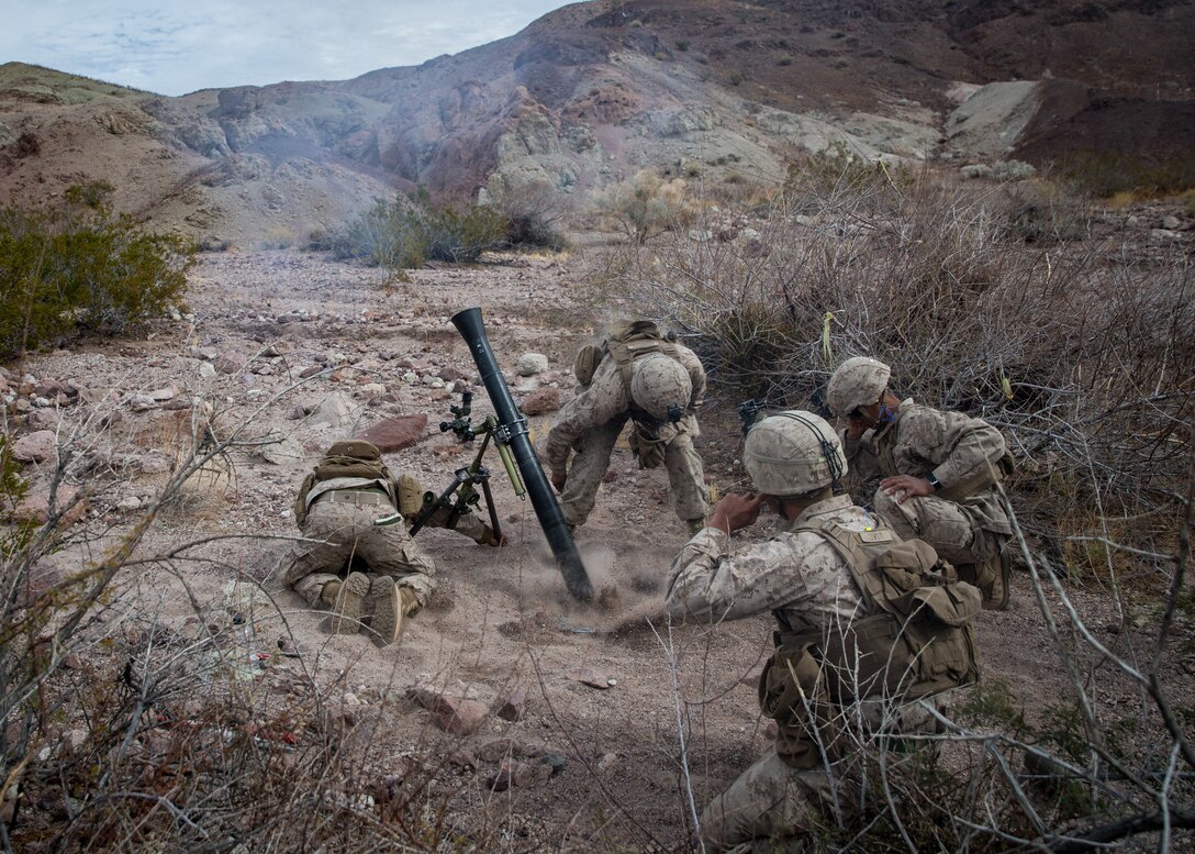 U.S. Marines with 3rd battalion, 5th Marine Regiment, 1st Marine Division, fire an 81mm mortar in support of the Battalion Distributed Operations Course on Marine Corps Air-Ground Combat Center, Twentynine Palms, Calif., Feb. 9, 2021. The training is part of Integrated Training Exercise (ITX) 2-21, a combined arms training exercise intended to produce combat ready forces capable of operating as an integrated Marine Air-Ground Task Force. (U.S. Marine Corps photo by Lance Cpl. Brian Bolin Jr.)
