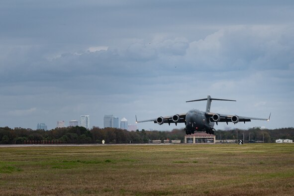 A photo of an aircraft landing on a runway