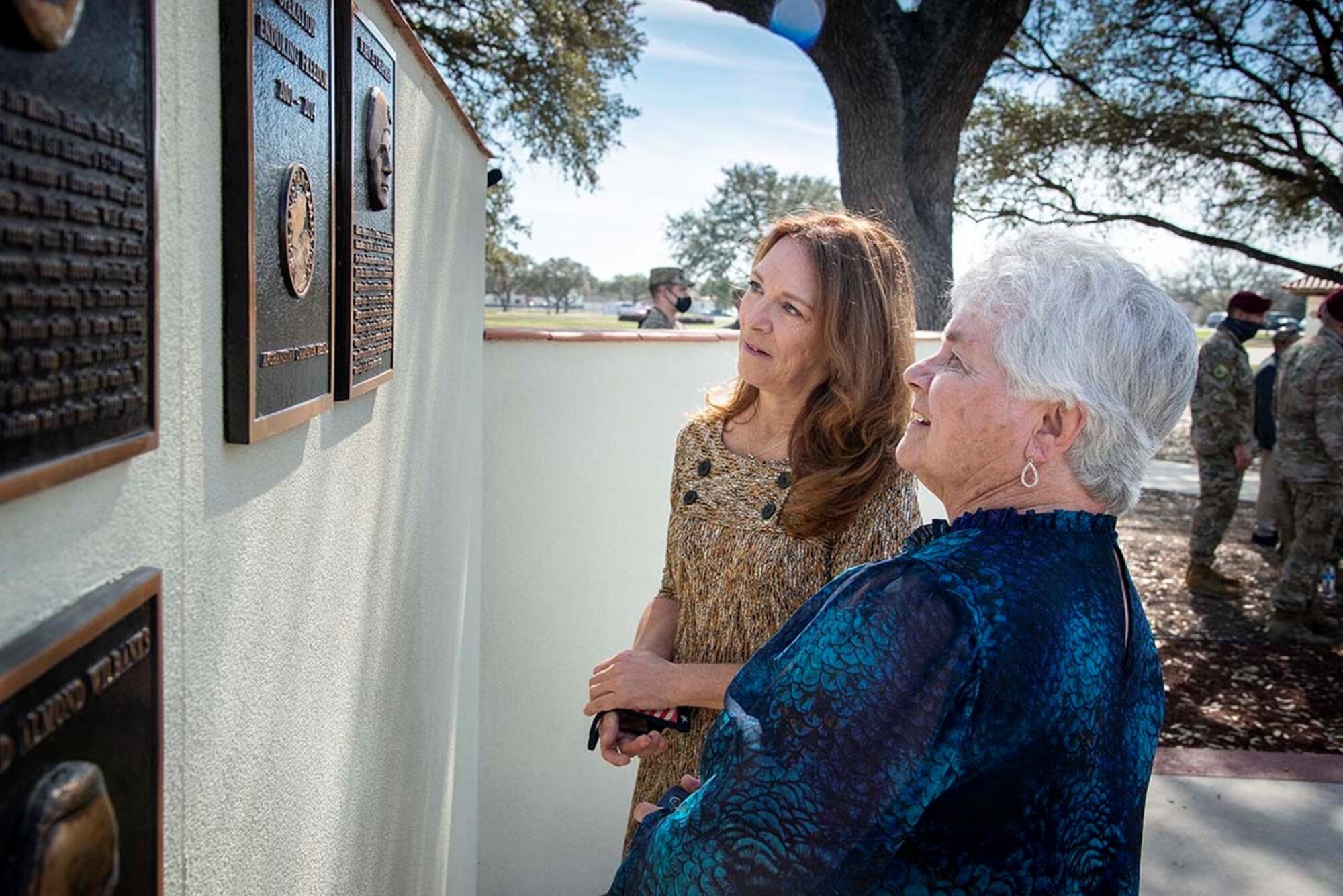 Valerie Nessel (left), Medal of Honor recipient John Chapman’s spouse, and Terry Chapman, Chapman’s mother, view the plaque that was unveiled during a Medal of Honor plaque ceremony at Airmen’s Heritage Park at Joint Base San Antonio-Randolph March 4, 2021.