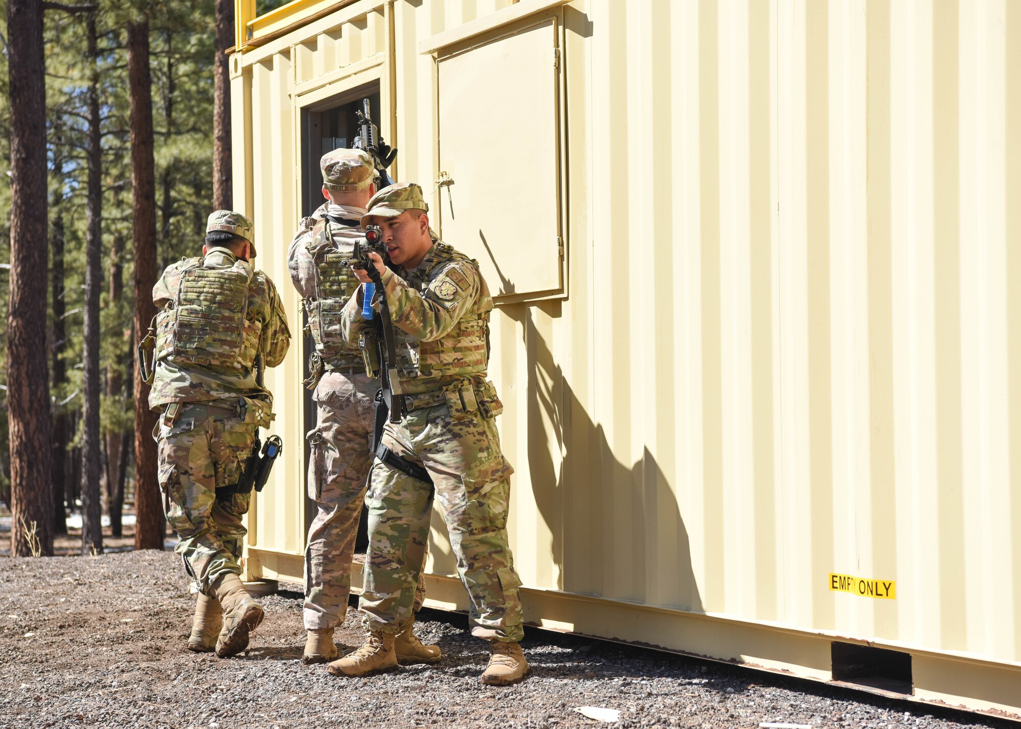 Reserve Citizen Airmen from the 944th Security Forces Squadron practice close quarter battle tactics during a deployment training exercise, March 6, 2021 at Camp Navajo, Bellemont, Arizona. During the four-day exercise, Airmen participated in classroom instruction and hands-on training including recovery missions, land navigation, weapons qualification, and base security operations.