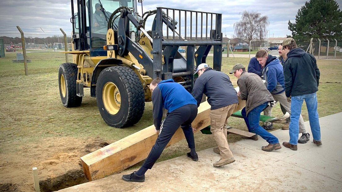 Scout Troop 215, Lakenheath High School Junior Reserve Officers' Training Corps and over 50 volunteers worked to construct a heritage arch on the path to the flightline at Royal Air Force Lakenheath, England, March 6, 2021. The arch was built as an Eagle Scout project, an opportunity for a Scout to demonstrate leadership abilities while completing a project for the benefit of their community. (Courtesy Photo)