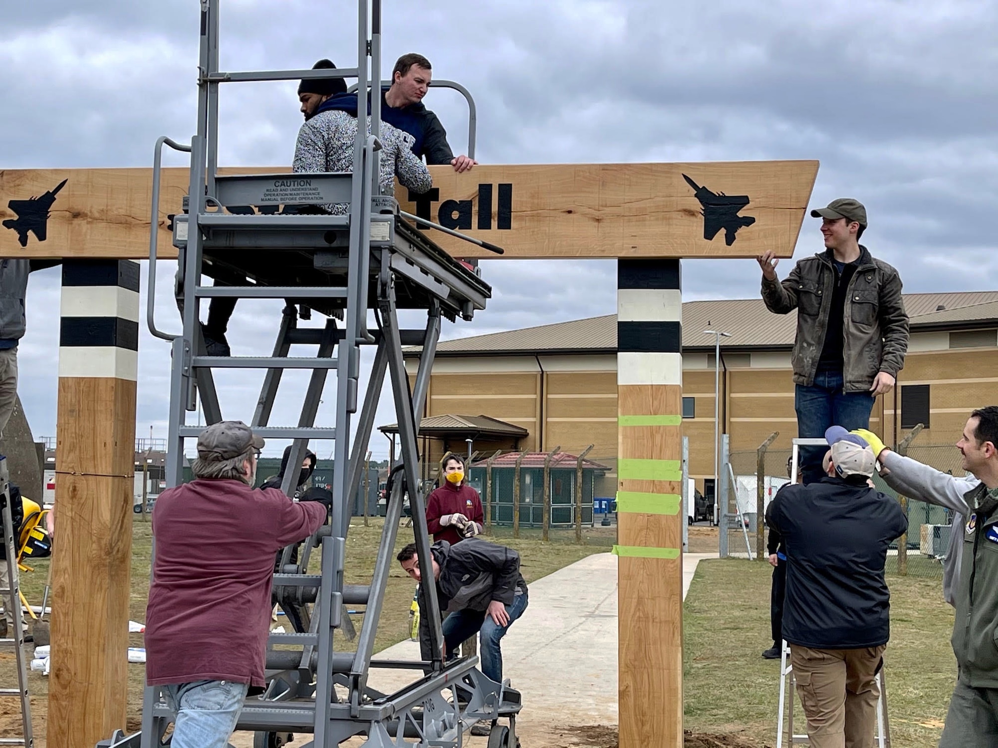 Scout Troop 215, Lakenheath High School Junior Reserve Officers' Training Corps and over 50 volunteers worked to construct a heritage arch on the path to the flightline at Royal Air Force Lakenheath, England, March 6, 2021. The arch was built as an Eagle Scout project, an opportunity for a Scout to demonstrate leadership abilities while completing a project for the benefit of their community. (Courtesy Photo)