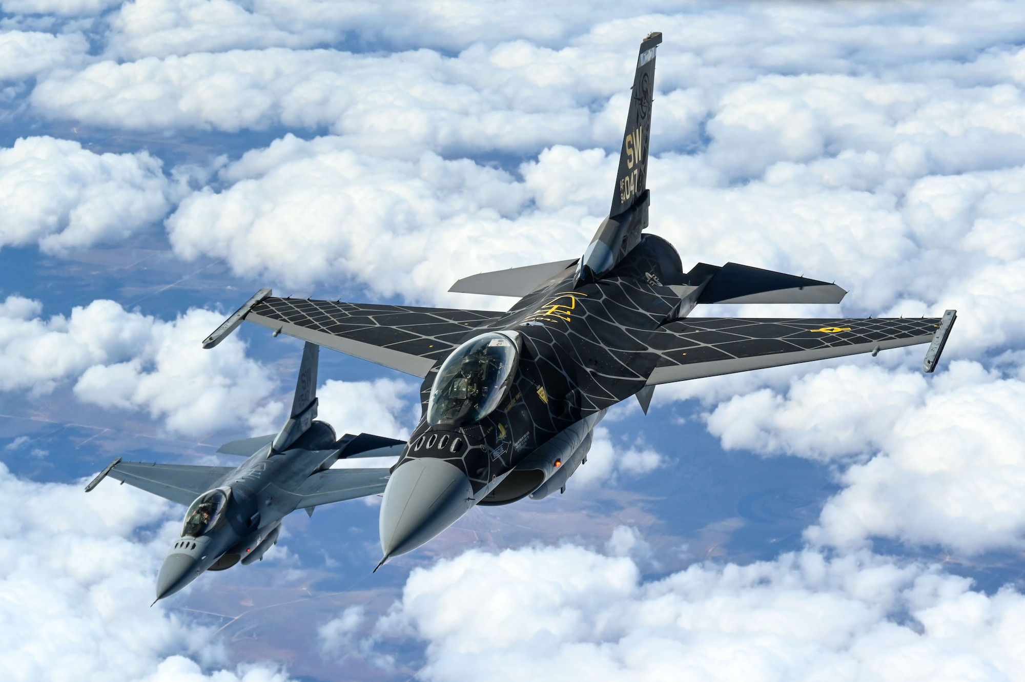 F-16 Viper Demonstration Team pilots fly behind a KC-135 Stratotanker from the 465th Air Refueling Squadron at Tinker Air Force Base, Oklahoma, March 8, 2021. The F-16 team from Shaw Air Force Base, South Carolina, is assigned to Air Combat Command and received fuel from the Okies during their flight back to  their home station after performing at an air show. (U.S. Air Force photo by Senior Airman Mary Begy)