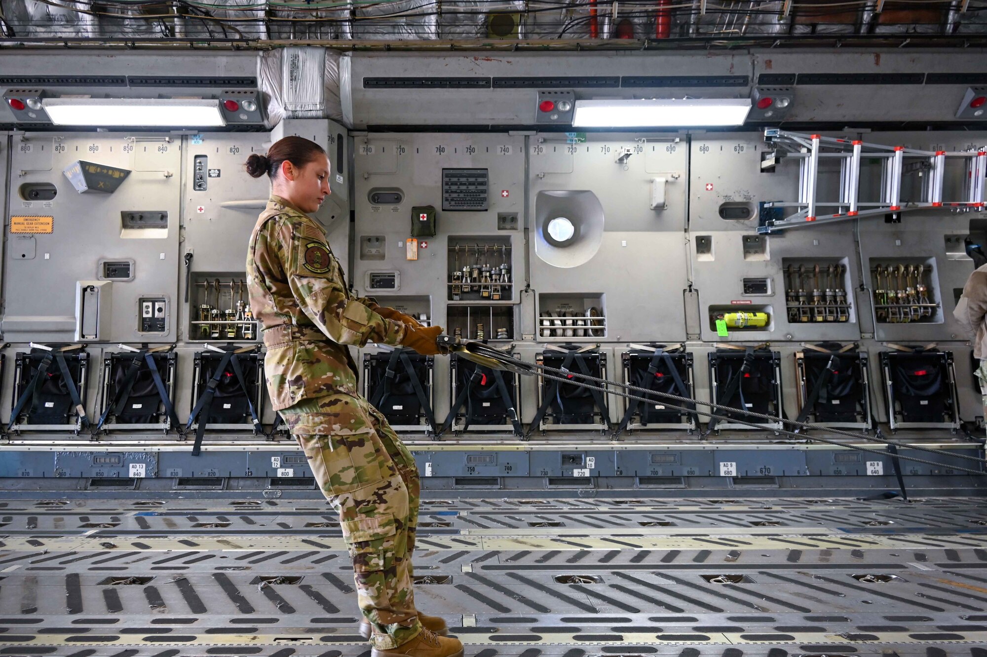 A student from the 97th Training Squadron loads a C-17 Globemaster March 4, 2021, Altus Air Force Base, Oklahoma. (U.S. Air Force photo by Senior Airman Mary Begy)