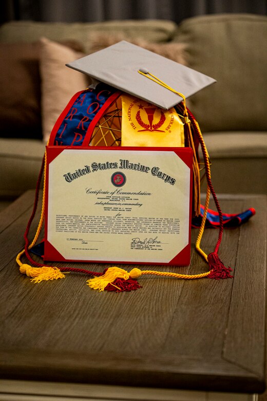 U.S. Marine Corps Sgt. Jerre’al Hayles, a Pacific trial team paralegal with the Legal Service Support Section, displays her educational achievements on Camp Foster, Okinawa, Japan, March 10, 2021. Hayles won the 2020 Trial Service Office Marine of the Year award for going above and beyond the expectations and duties within the unit. Hayles is a native of Smithfield, Virginia. (U.S. Marine Corps photo by Cpl. Karis Mattingly)