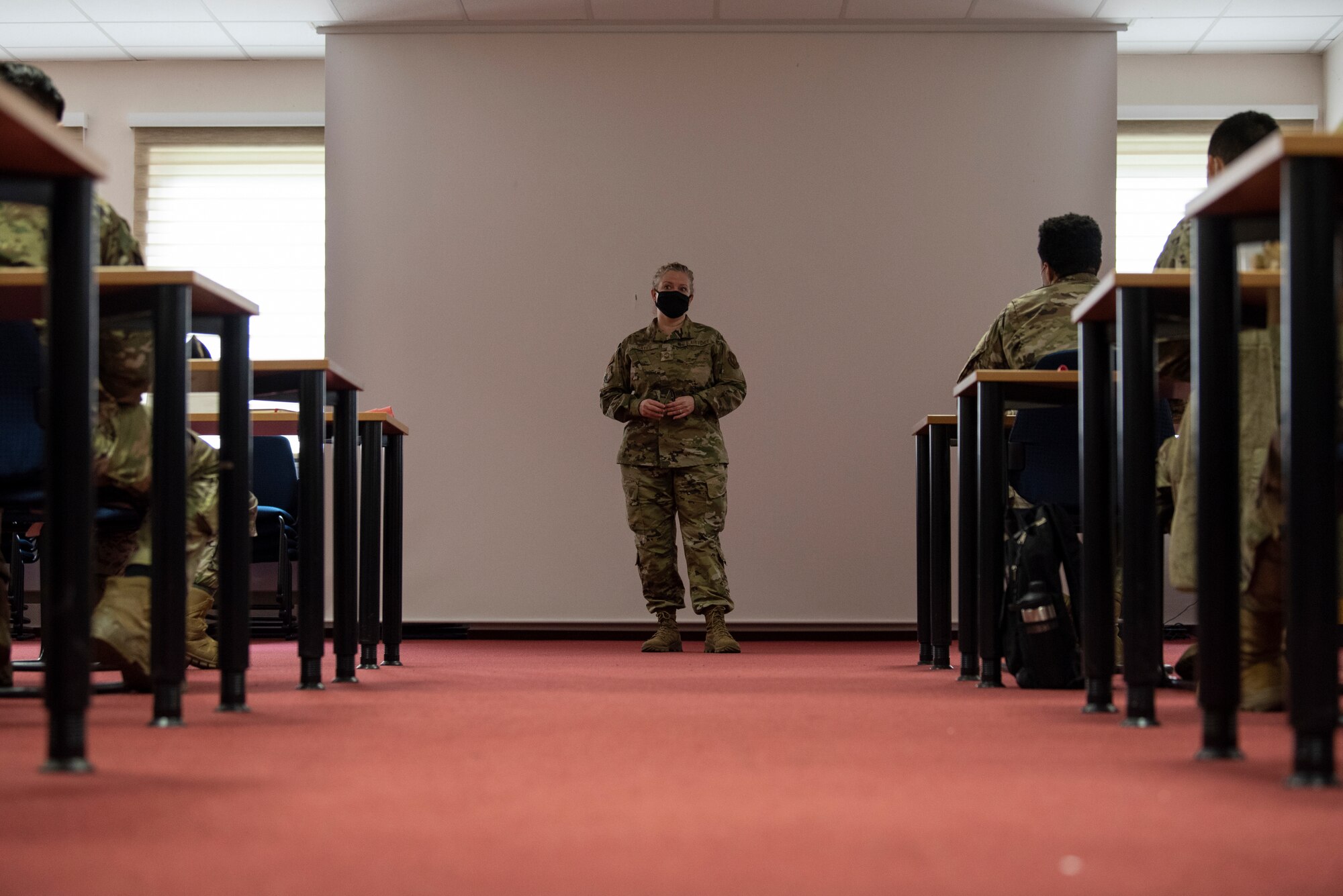 U.S. Air Force Chief Master Sgt. Stephanie Cates, 52nd FW command chief, speaks to U.S. Air Force Airmen at the end of an NCO professional development seminar in the Saber Conference Center on Spangdahlem Air Base, Germany, March 5, 2021.
