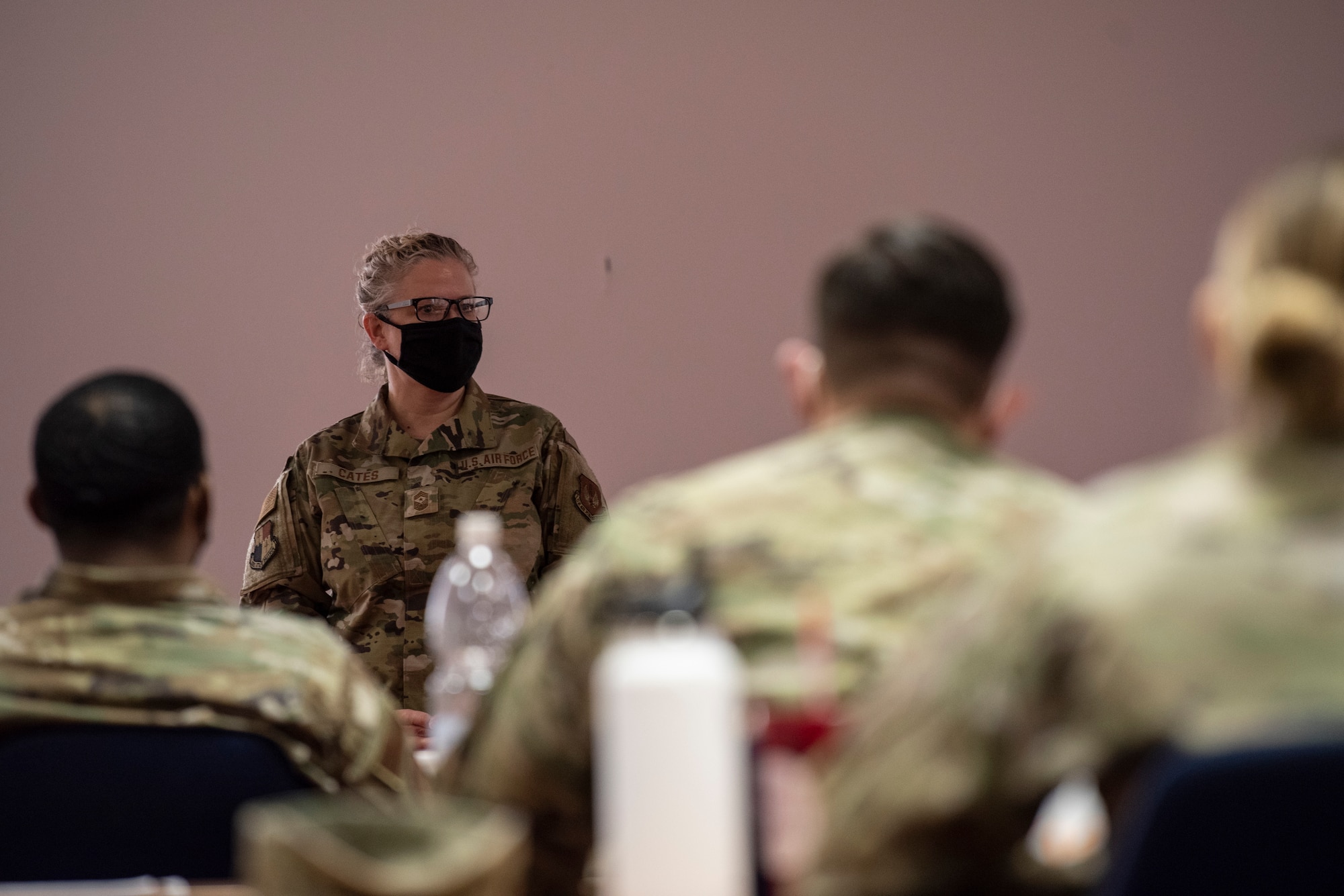 U.S. Air Force Chief Master Sgt. Stephanie Cates, 52nd FW command chief, speaks to U.S. Air Force Airmen at the end of an NCO professional development seminar in the Saber Conference Center on Spangdahlem Air Base, Germany, March 5, 2021.
