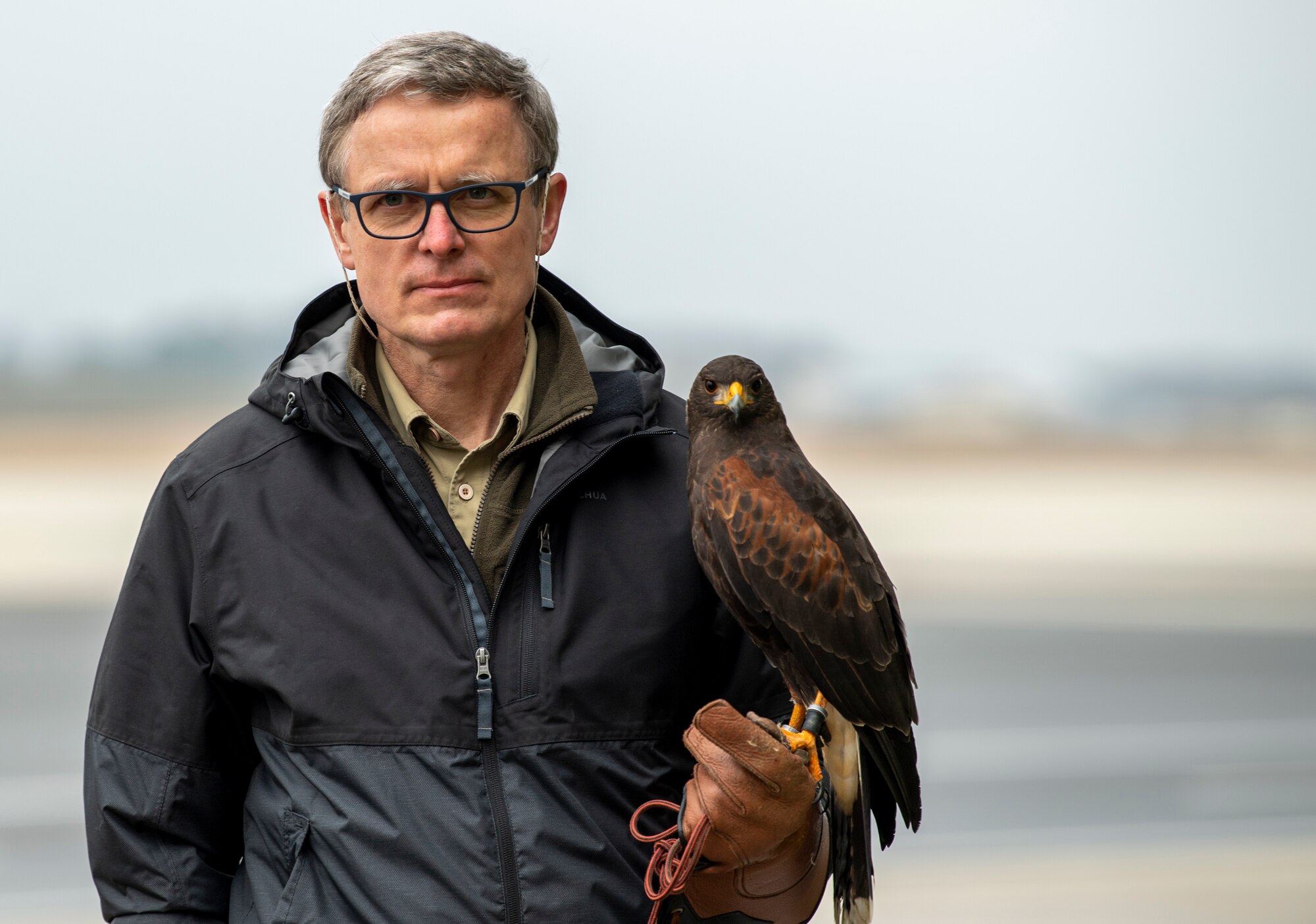 Jens Fleer, 52nd Fighter Wing base falconer, holds his hawk during a demonstration at the 726th Air Mobility Squadron on Spangdahlem Air Base, Germany, March 5, 2021.