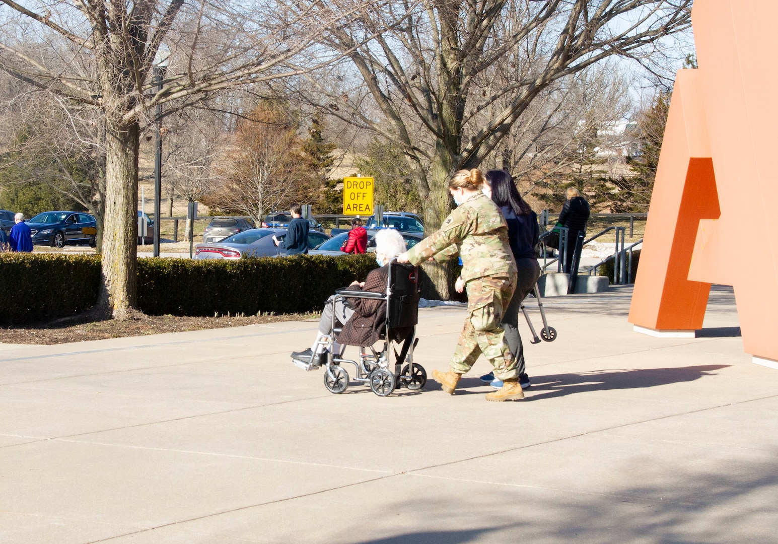 A Kentucky National Guard Soldier transports a Kentucky resident while supporting the Kentucky Horse Park COVID-19 vaccine distribution site in Lexington, Ky., Feb. 25, 2021. The KYNG assisted Kentucky Emergency Management and other public and private partners to support seven mass vaccination sites across the commonwealth.