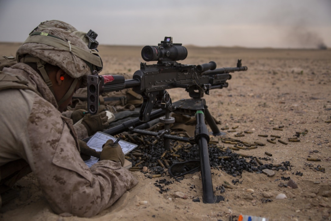 Marines assigned to Charlie Company, Battalion Landing Team 1/4, 15th Marine Expeditionary Unit (MEU), conduct a night live-fire attack exercise during a theater amphibious combat rehearsal (TACR) at Camp Buehring, Kuwait, Feb. 23.