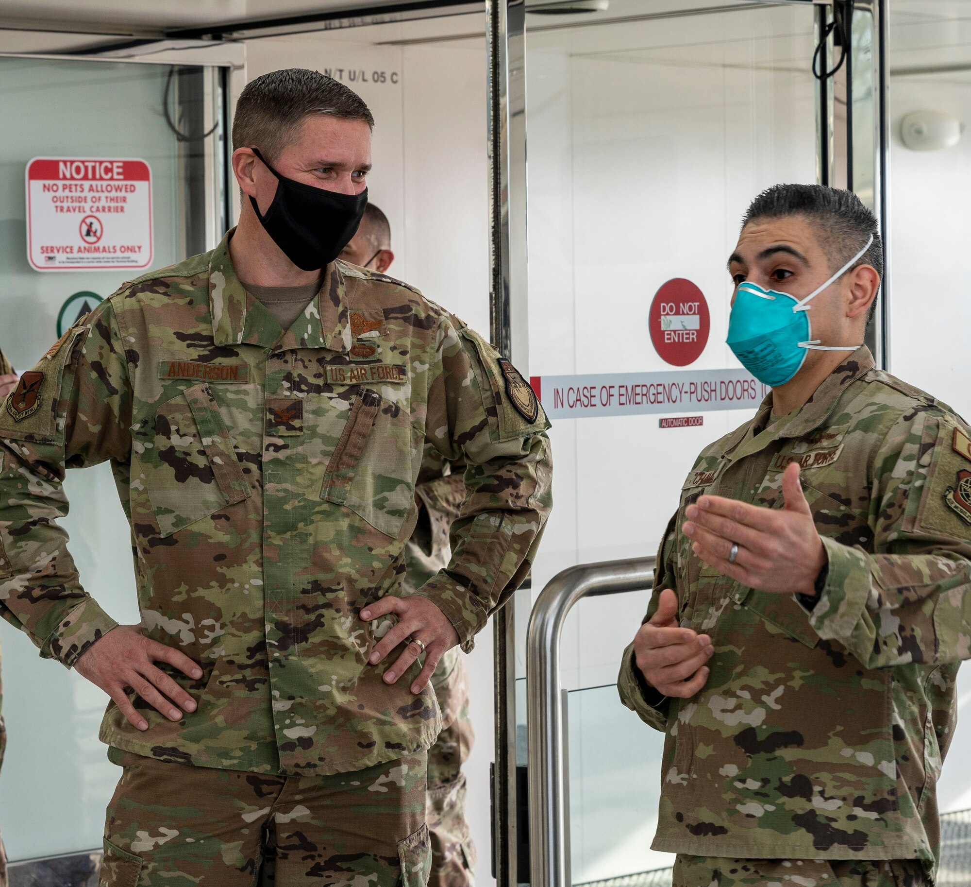 Col. Shannon Anderson (left), 436th Airlift Wing vice commander, speaks with Capt. Samuel Chavez, Patriot Express COVID-19 testing site officer in charge, at the Baltimore/Washington International Thurgood Marshall Airport in Baltimore, Maryland, March 9, 2021. The testing facility team ensures the health and safety of service members and their families by providing on-site, rapid COVID-19 testing for individuals traveling to overseas duty locations. Patriot Express flights are operated by commercial airlines contracted by the Department of Defense. (U.S. Air Force photo by Airman 1st Class Cydney Lee)
