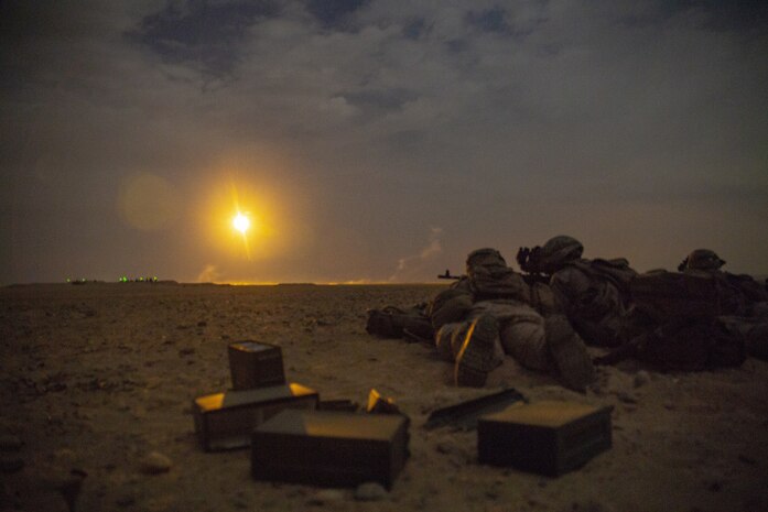 Marines assigned to Charlie Company, Battalion Landing Team 1/4, 15th Marine Expeditionary Unit, conduct a night live-fire attack exercise during a theater amphibious combat rehearsal at Camp Buehring, Kuwait, Feb. 23