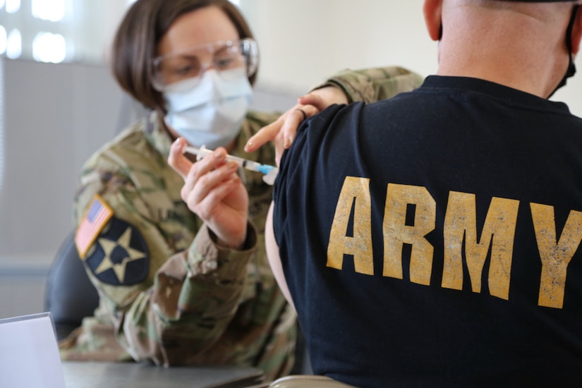 US Army Nurse, Master Sgt. Carolyn Lange Administers the Covid-19 Vaccine to Retirees and other qualified applicants on Fort Meade, Md. Friday, February 26.