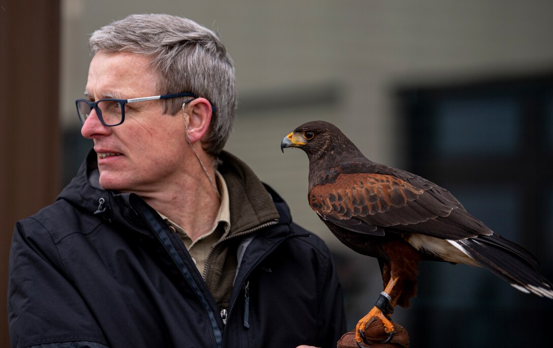 Jens Fleer, 52nd Fighter Wing base falconer, prepares to hunt with his male hawk, Jack, at Spangdahlem Air Base, Germany, March 5, 2021.
