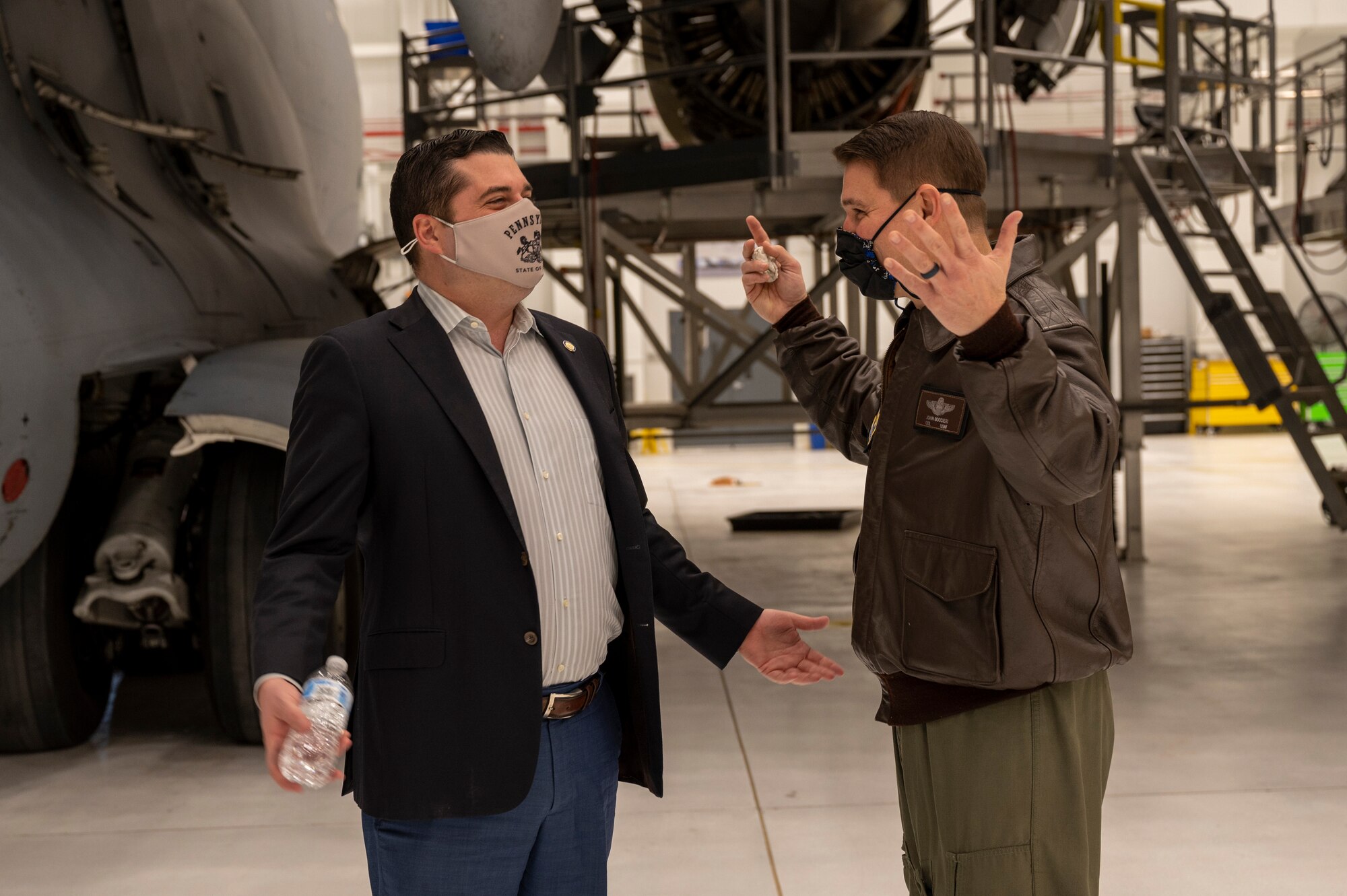 Col. John Boccieri, 911th Airlift Wing vice commander, explains the process of building the new two-bay hangar to Pennsylvania State Sen. Devlin Robinson at the Pittsburgh International Airport Air Reserve Station, Pennsylvania, Feb. 26, 2021.