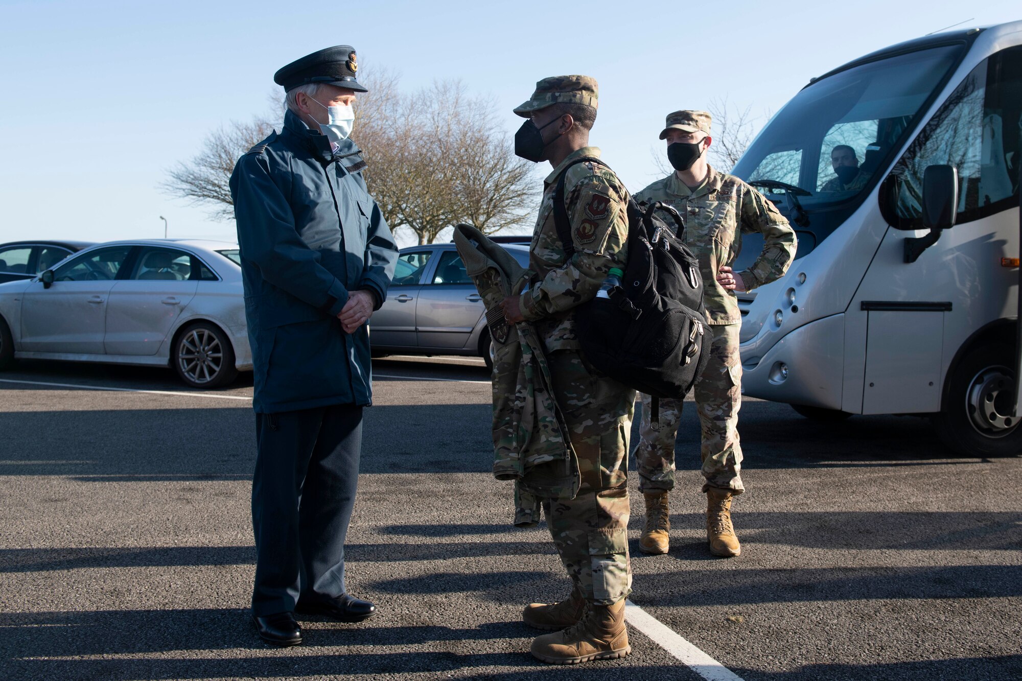 Royal Air Force Sqn. Ldr. Clive Wood, left, Royal Air Force Alconbury and RAF Molesworth RAF commander, welcomes Brig. Gen. Ronald E. Jolly Sr., center, U.S. Air Forces in Europe and Air Forces Africa logistics, engineering and force protection director, to the 423rd Air Base Group at RAF Alconbury, England, March 10, 2021. The 501st CSW hosted an immersion tour for Jolly and his leadership team, demonstrating the mission set and capabilities of several organizations including the security forces, logistics readiness and civil engineer squadrons. (U.S. Air Force photo by Senior Airman Jennifer Zima)