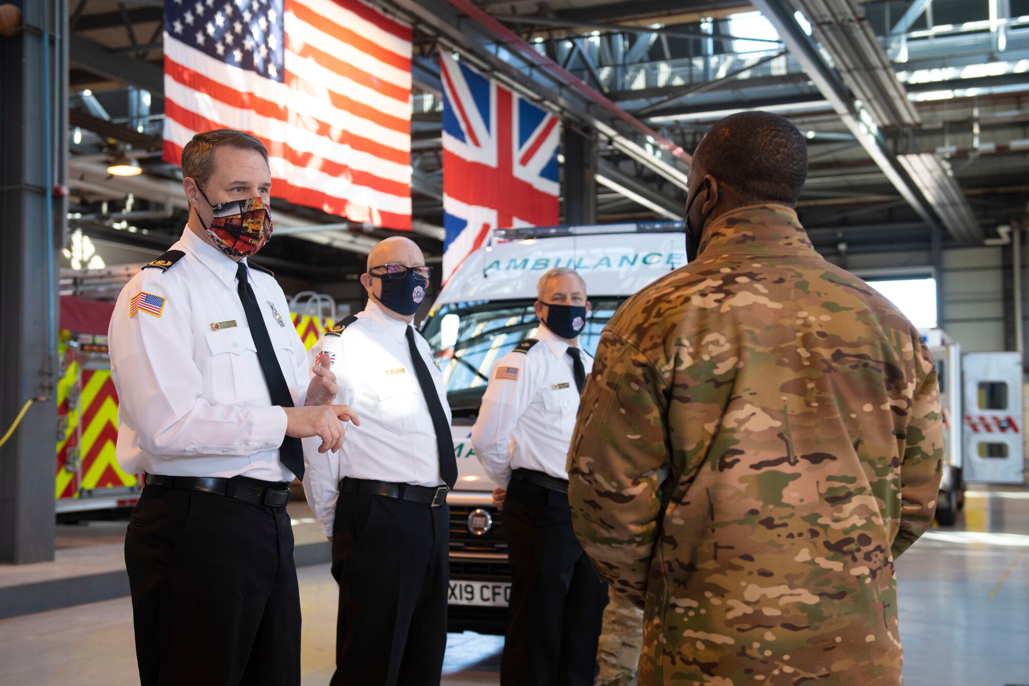 J. Evett, left, 423rd Civil Engineer  Squadron fire chief, briefs Brig. Gen. Ronald E. Jolly Sr., right, U.S. Air Forces in Europe and Air Forces Africa logistics, engineering and force protection director, about the fire department and emergency response capabilities at Royal Air Force Alconbury, England, March 10, 2021. The 501st CSW hosted an immersion tour for Jolly and his leadership team, demonstrating the mission set and capabilities of several organizations including the security forces, logistics readiness and civil engineer squadrons. (U.S. Air Force photo by Senior Airman Jennifer Zima)