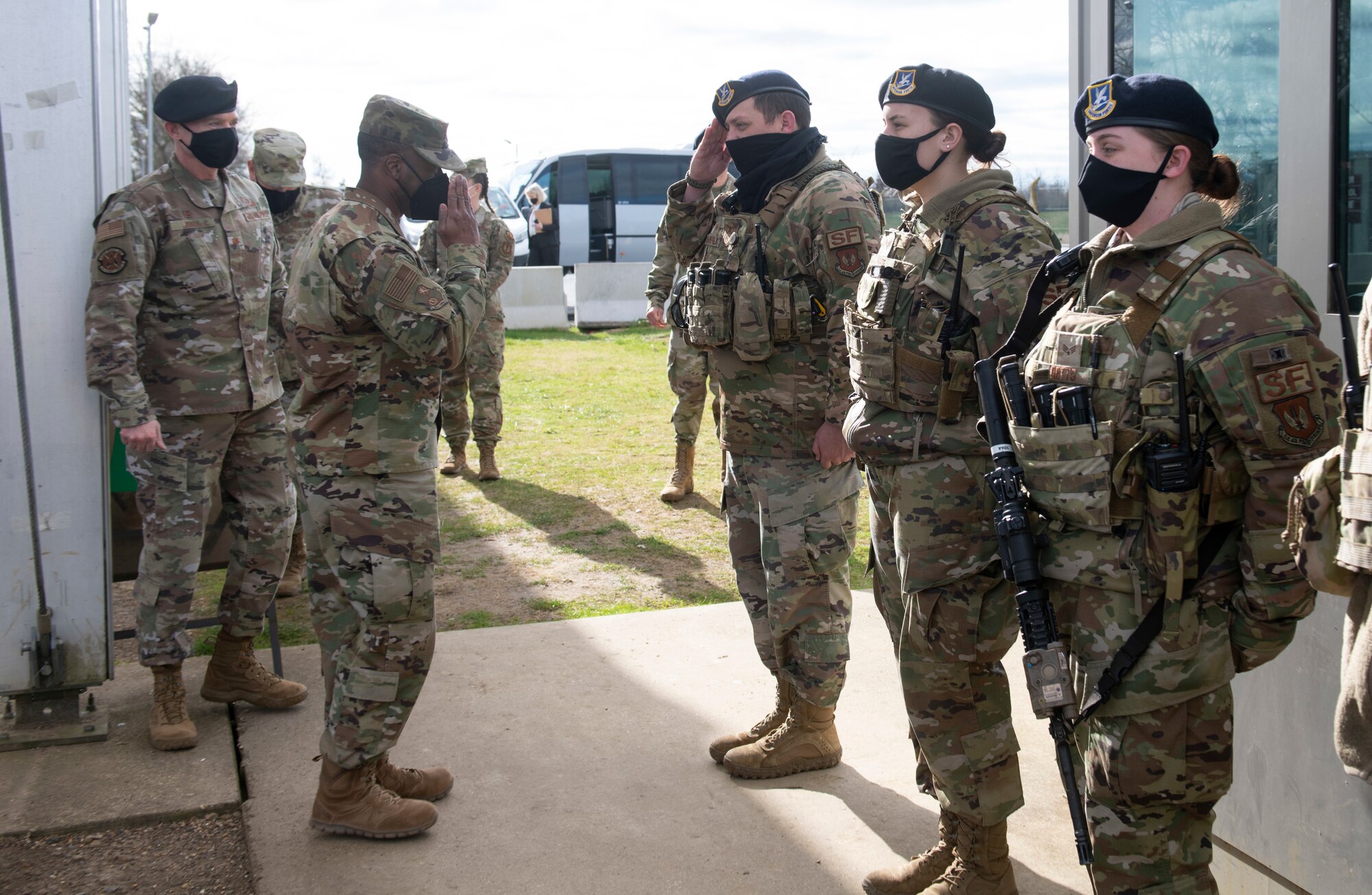 U.S. Air Force Brig. Gen. Ronald E. Jolly Sr., left, U.S. Air Forces in Europe and Air Forces Africa logistics, engineering and force protection director, greets a 423rd Security Forces Squadron defender, at Royal Air Force Alconbury, England, March 10, 2021. The 501st CSW hosted an immersion tour for Jolly and his leadership team, demonstrating the mission set and capabilities of several organizations including the security forces, logistics readiness and civil engineer squadrons. (U.S. Air Force photo by Senior Airman Jennifer Zima)
