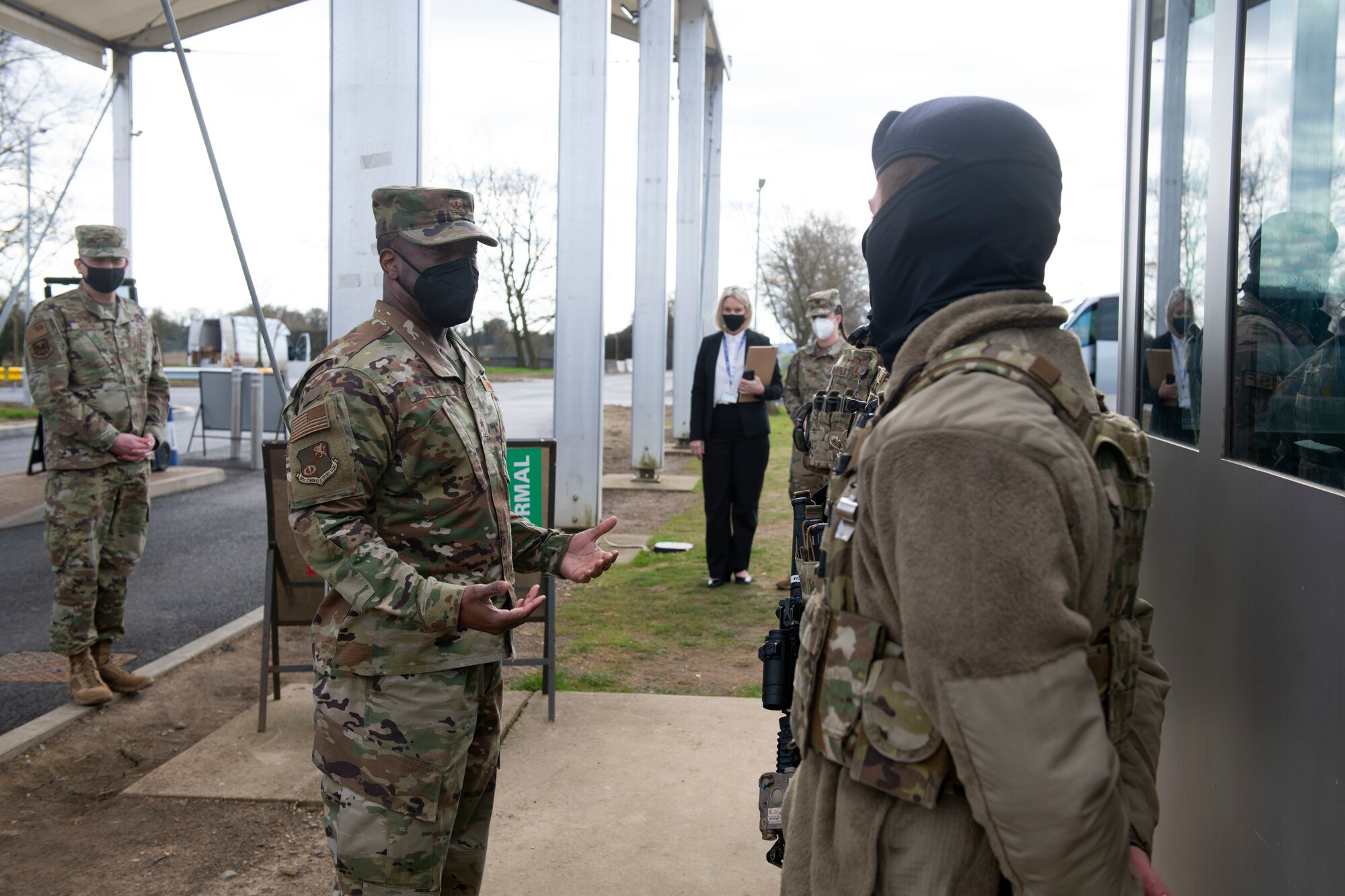 U.S. Air Force Brig. Gen. Ronald E. Jolly Sr., left, U.S. Air Forces in Europe and Air Forces Africa logistics, engineering and force protection director, greets 423rd Security Forces Squadron defenders at Royal Air Force Alconbury, England, March 10, 2021. The 501st CSW hosted an immersion tour for Jolly and his leadership team, demonstrating the mission set and capabilities of several organizations including the security forces, logistics readiness and civil engineer squadrons. (U.S. Air Force photo by Senior Airman Jennifer Zima)