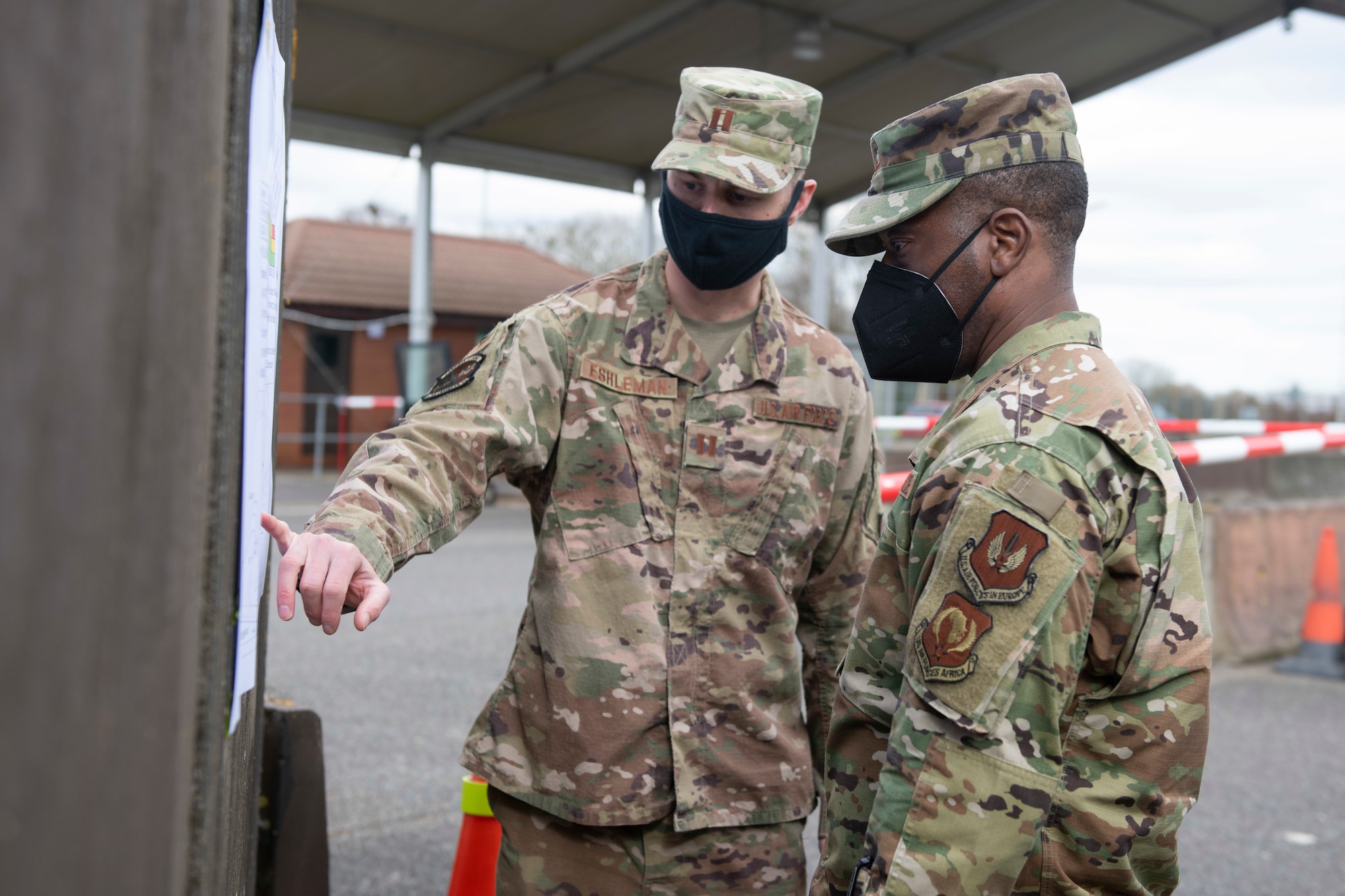 U.S. Air Force Capt. Justin Eshleman, left, 423rd Civil Engineer Squadron deputy engineer flight chief, briefs Brig. Gen. Ronald E. Jolly Sr., right, U.S. Air Forces in Europe and Air Forces Africa logistics, engineering and force protection director, about the gate project at Royal Air Force Molesworth, England, March 10, 2021. The 501st CSW hosted an immersion tour for Jolly and his leadership team, demonstrating the mission set and capabilities of several organizations including the security forces, logistics readiness and civil engineer squadrons. (U.S. Air Force photo by Senior Airman Jennifer Zima)