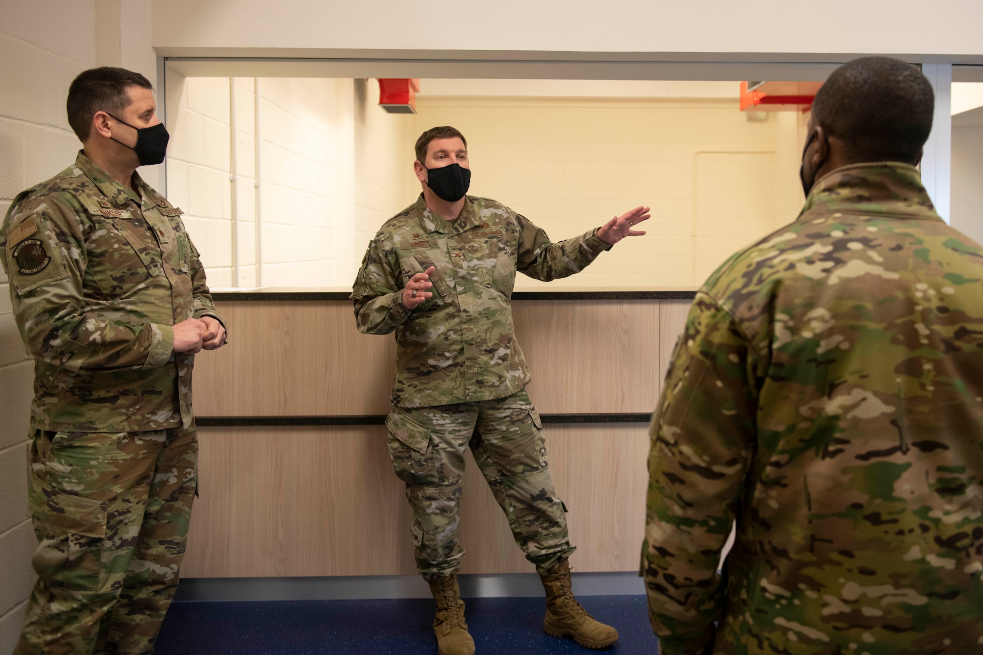 U.S. Air Force Col. Kurt Wendt, center, 501st Combat Support Wing commander, shares with Brig. Gen. Ronald E. Jolly Sr., right, U.S. Air Forces in Europe and Air Forces Africa logistics, engineering and force protection director, the renovation changes at the Royal Air Force Molesworth Fitness Center Annex, England, March 10, 2021. The 501st CSW hosted an immersion tour for Jolly and his leadership team, demonstrating the mission set and capabilities of several organizations including the security forces, logistics readiness and civil engineer squadrons. (U.S. Air Force photo by Senior Airman Jennifer Zima)